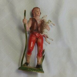 One of the three wise men from the nativity scene/shepherd the nativity scene